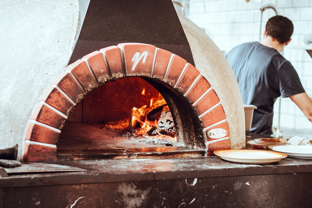 Cooking-Pizza-in-a-Pizza-Oven-1024x683